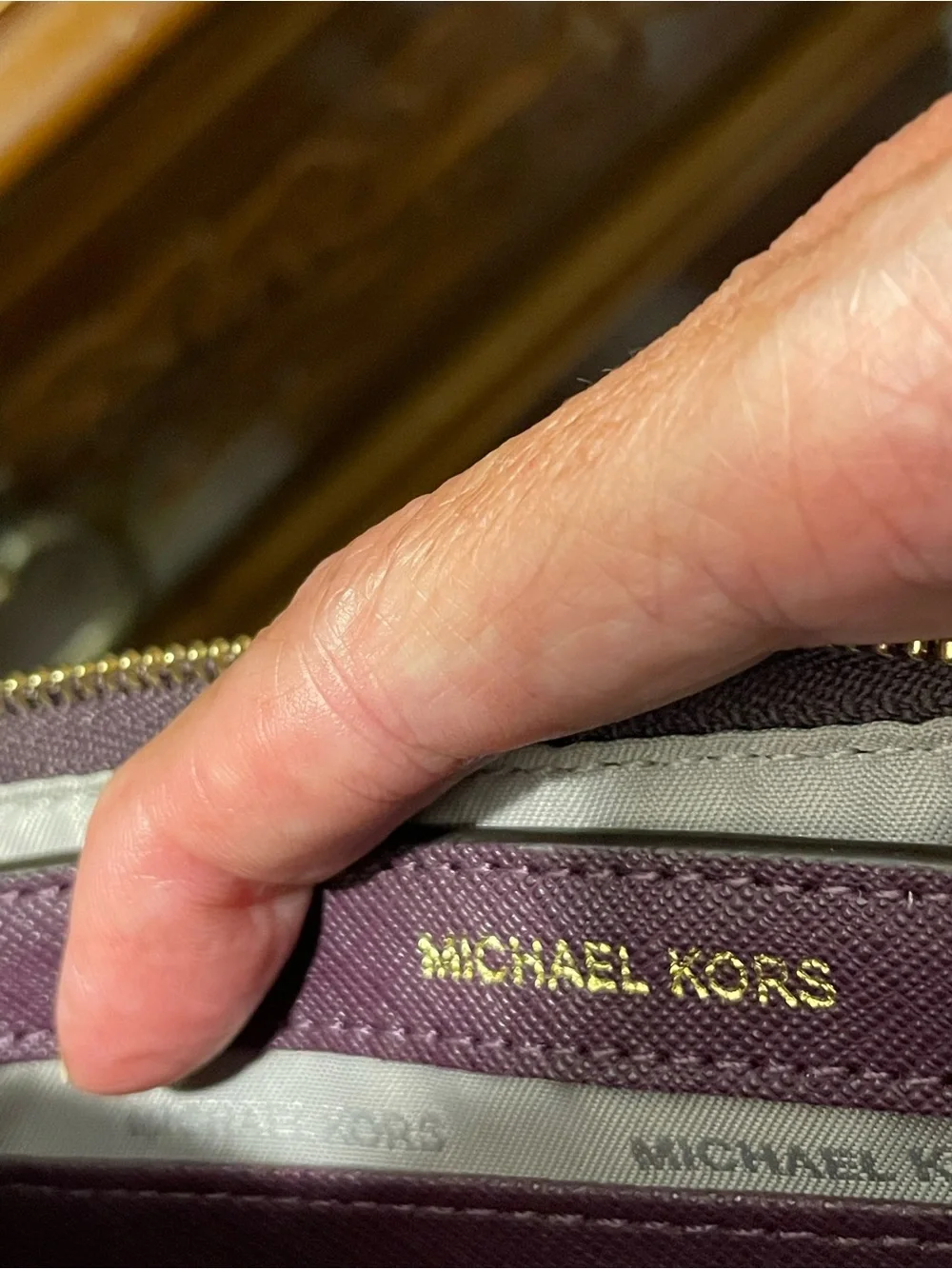 MICHAEL KORS  Brooklyn Plum Wristlet with Gold Eyelet Detail